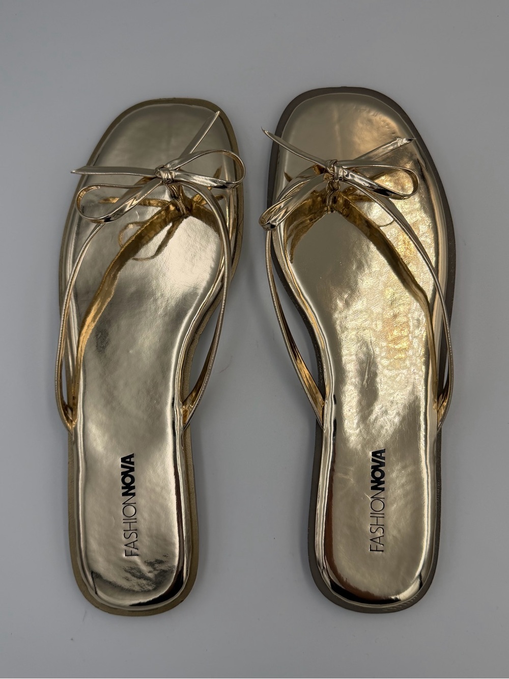 Fashion Nova Metallic Gold Bow-Accent Thong Sandals